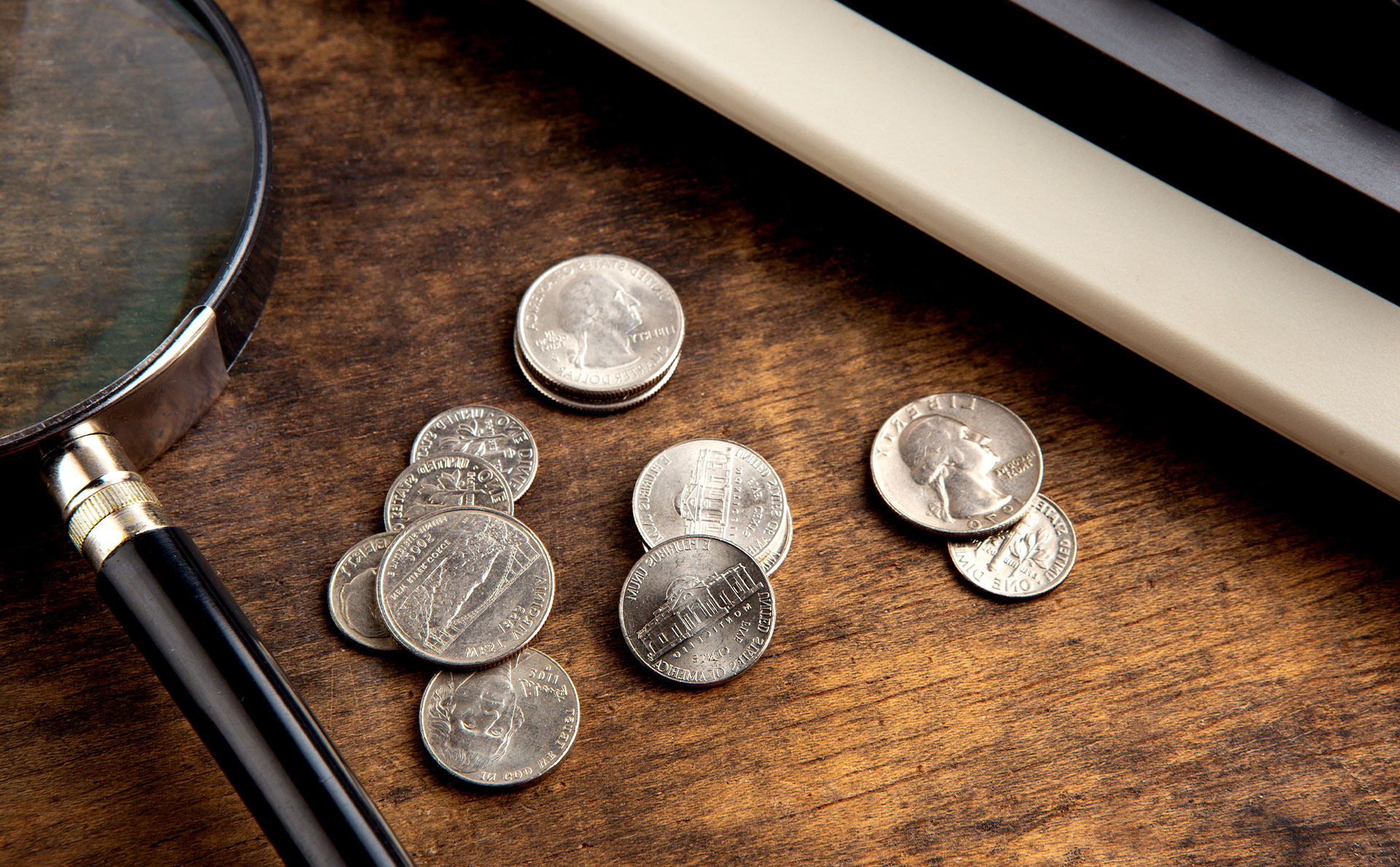 Coins on Table | Aluma Capital (Pty) Ltd