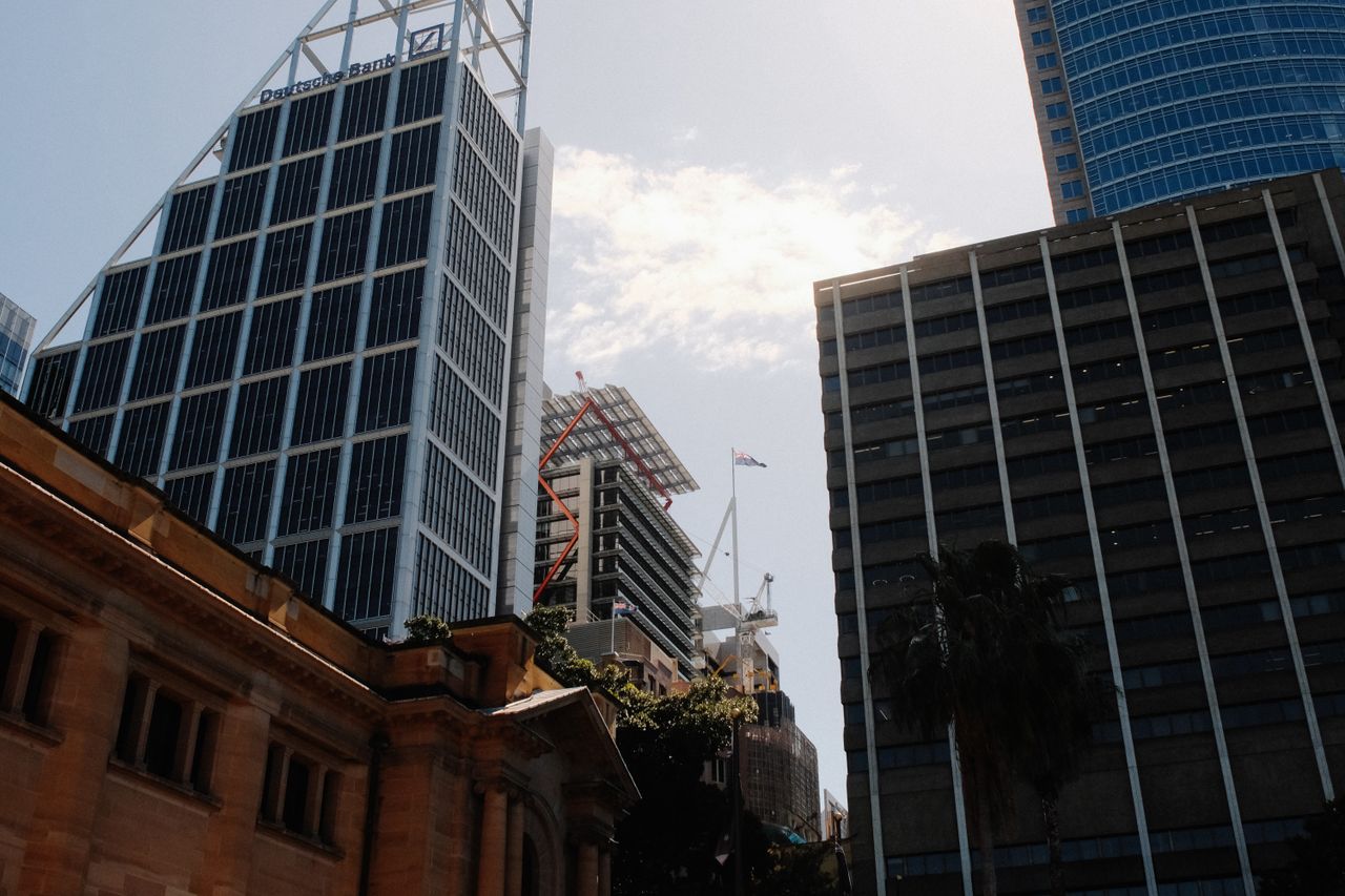 Services Impressive skyscrapers in Sydney's business district on a sunny day.