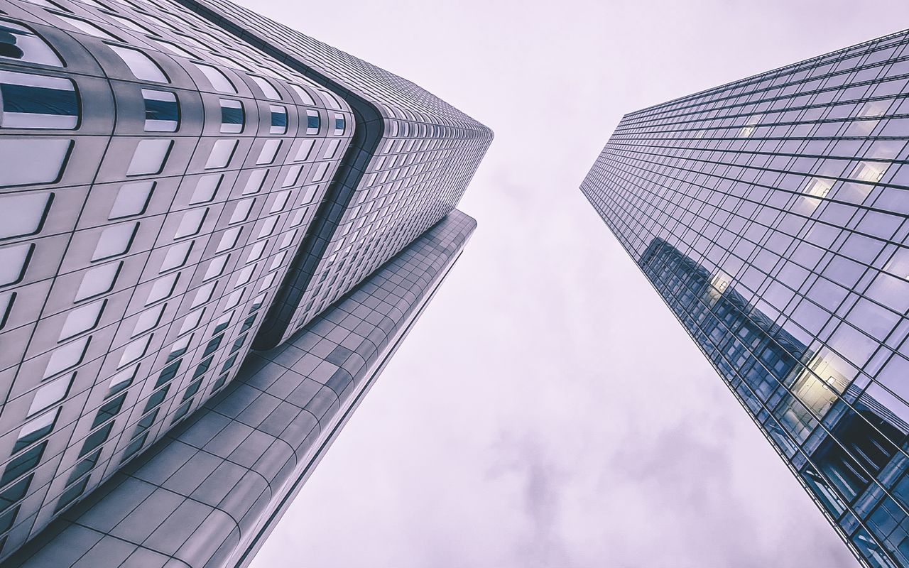 Services Low angle view of Silberturm and another skyscraper in Frankfurt showcasing modern architecture.
